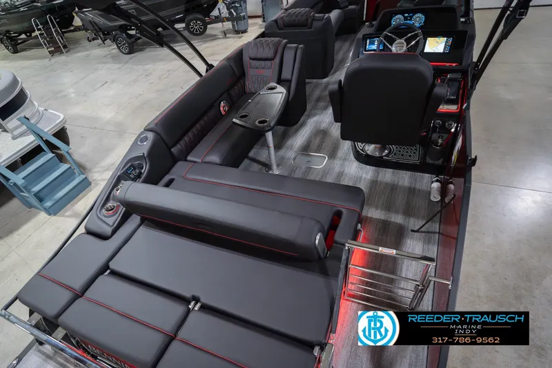 Slide: The Image of Interior of 2026 Bennington 25 RSB boat with luxurious seating and modern dashboard. - 14