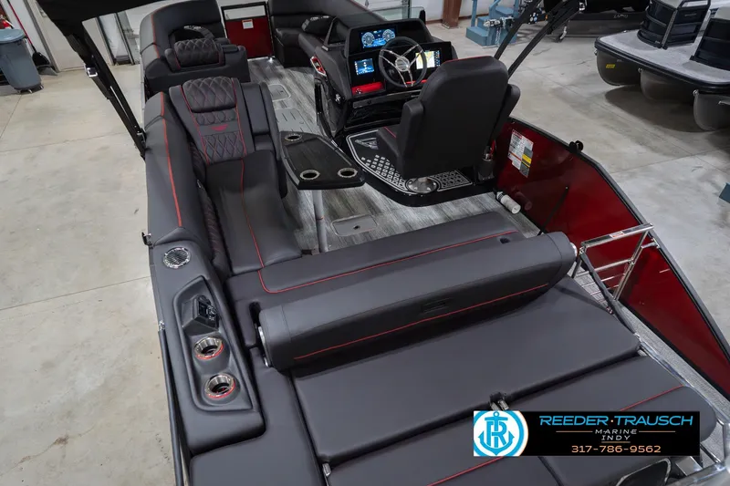 Slide: The Image of 2026 Bennington 25 RSB boat interior with luxurious seating and modern dashboard. - 15