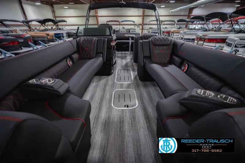 Slide: The Image of Luxurious interior of 2026 Bennington 25 RSB pontoon boat with plush seating and cup holders. - 16