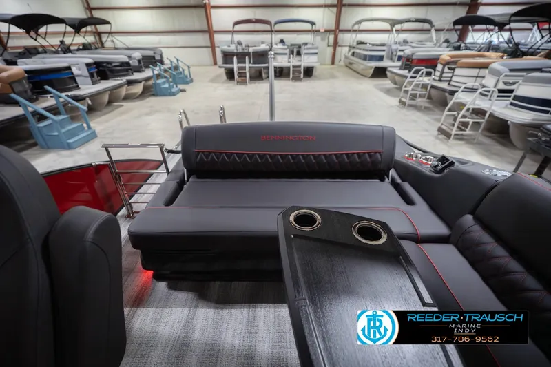 Slide: The Image of Interior of 2026 Bennington 25 RSB pontoon boat with luxurious seating and cup holders. - 18