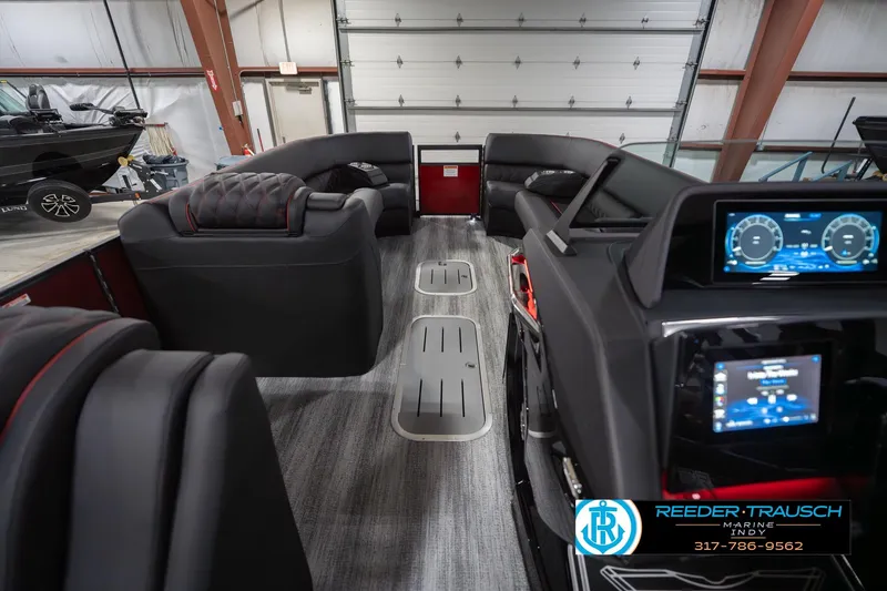 Slide: The Image of 2026 Bennington 25 RSB boat interior with modern dashboard and luxurious seating. - 20