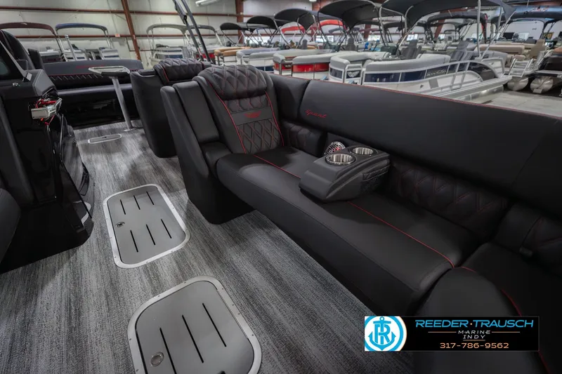 Slide: The Image of Luxurious interior of 2026 Bennington 25 RSB pontoon boat with plush seating and cup holders. - 22