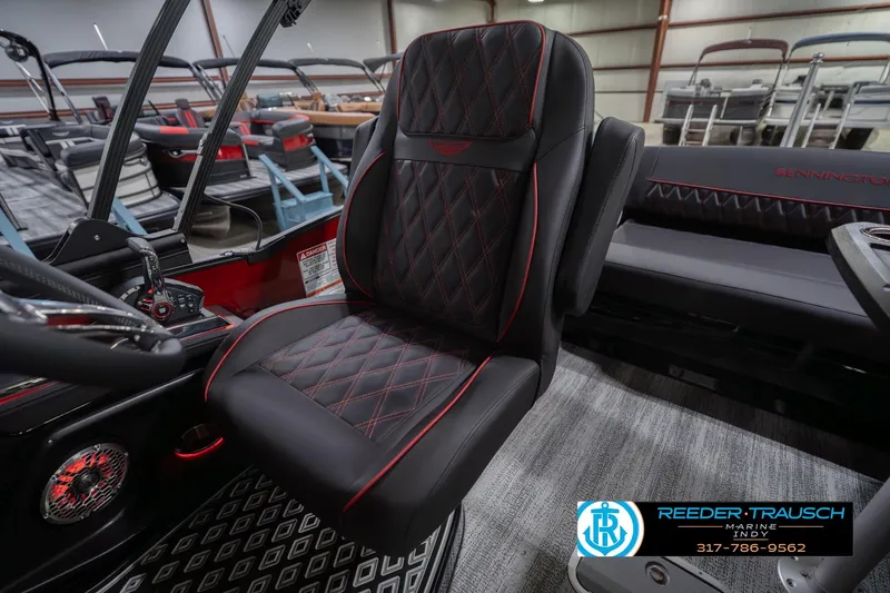Slide: The Image of 2026 Bennington 25 RSB boat interior with luxurious black and red diamond-stitched seating. - 27