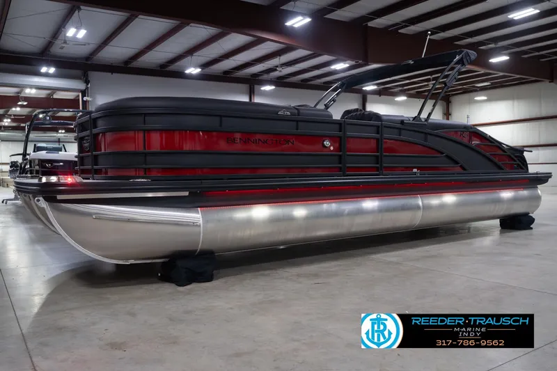 Slide: The Image of 2026 Bennington 25 RSB pontoon boat in a showroom, featuring sleek design and modern amenities. - 3