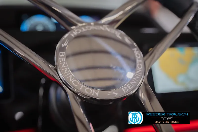 Slide: The Image of Steering wheel of 2026 Bennington 25 RSB boat, featuring sleek design and branding. - 37