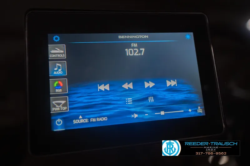 Slide: The Image of Touchscreen display of a 2026 Bennington 25 RSB, showing FM radio controls. - 39