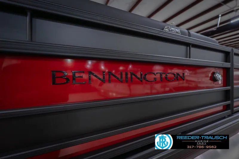 Slide: The Image of 2026 Bennington 25 RSB boat with sleek red and black design, Reeder-Trausch Marine logo. - 53