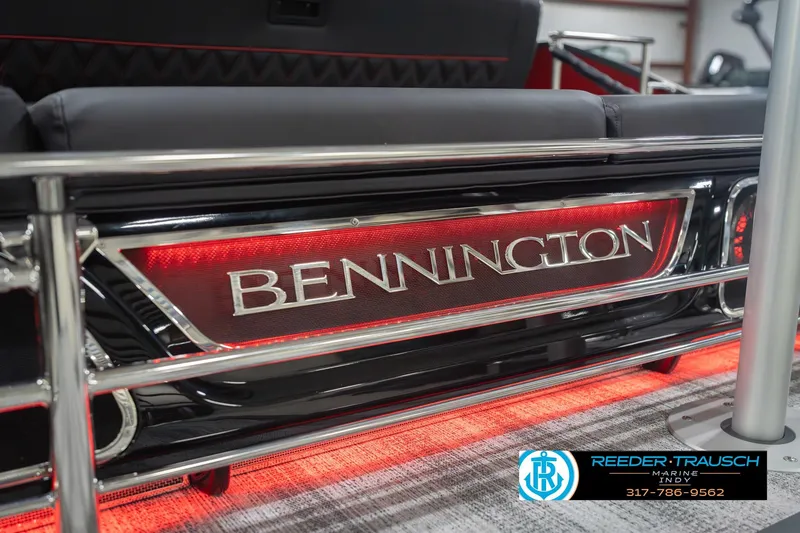 Slide: The Image of 2026 Bennington 25 RSB boat with illuminated branding and sleek design. - 55