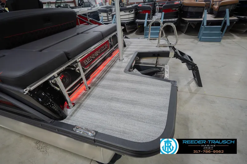 Slide: The Image of 2026 Bennington 25 RSB boat interior with seating and swim platform, showcased at Reeder-Trausch Marine. - 56