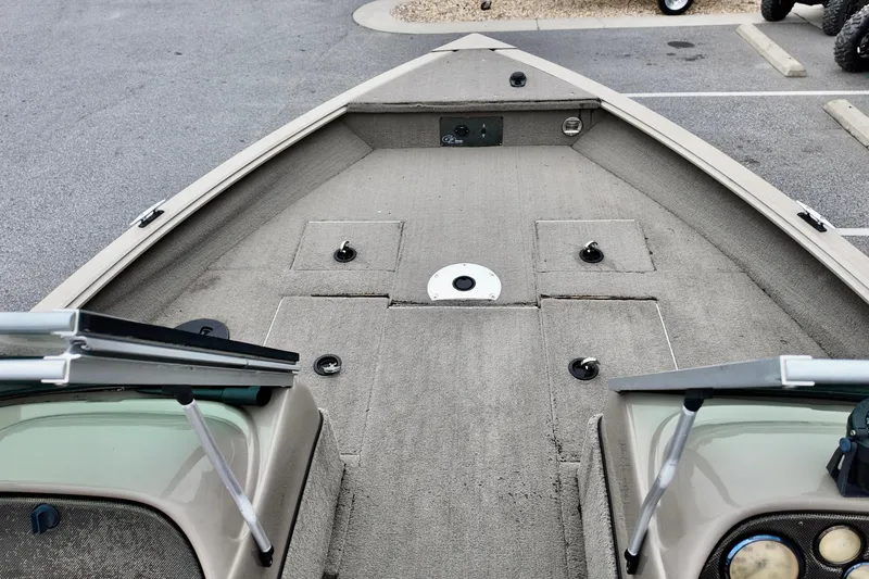 Slide: The Image of 2013 G3 Angler V172 F boat interior with carpeted deck and storage compartments. - 10