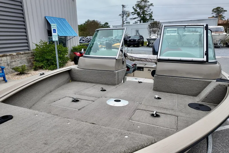 Slide: The Image of 2013 G3 Angler V172 F boat interior with carpeted deck and windshield. - 11