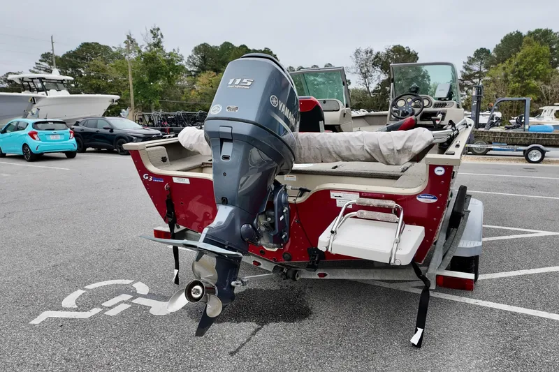 Slide: The Image of 2013 G3 Angler V172 F boat with Yamaha 115 outboard motor in parking lot. - 4