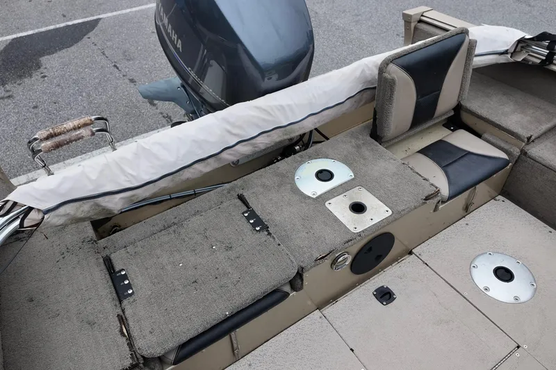 Slide: The Image of 2013 G3 Angler V172 F boat interior with seating and motor, showcasing fishing setup. - 5