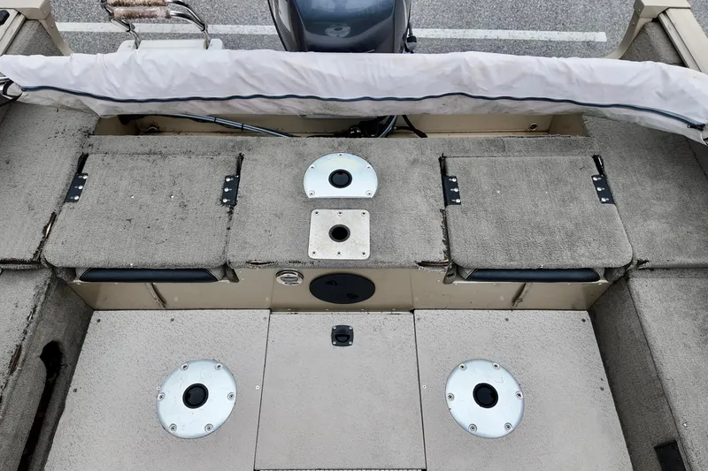 Slide: The Image of 2013 G3 Angler V172 F boat interior with storage compartments and seat bases. - 6