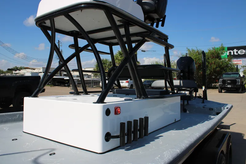 Slide: The Image of 2024 Shoalwater 23 Catamaran with Minn Kota motor, parked on a trailer. - 14