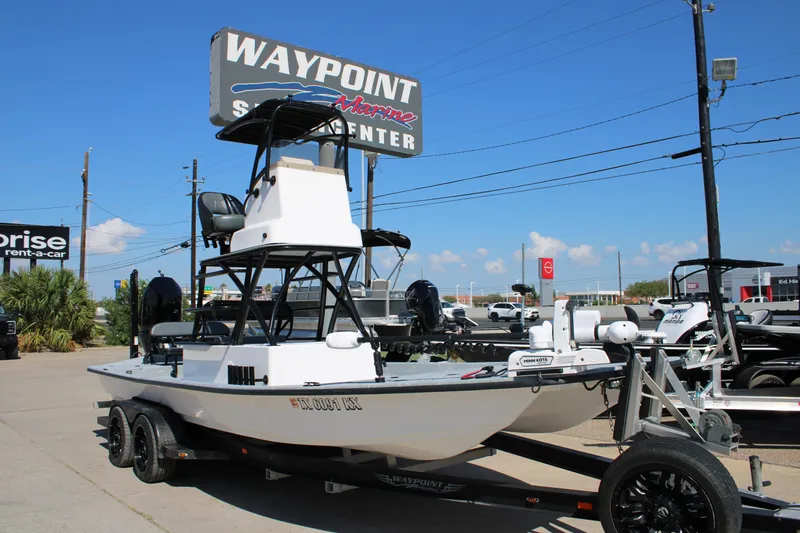 Slide: The Image of 2024 Shoalwater 23 Catamaran at Waypoint Marine Supercenter, clear sky background. - 18