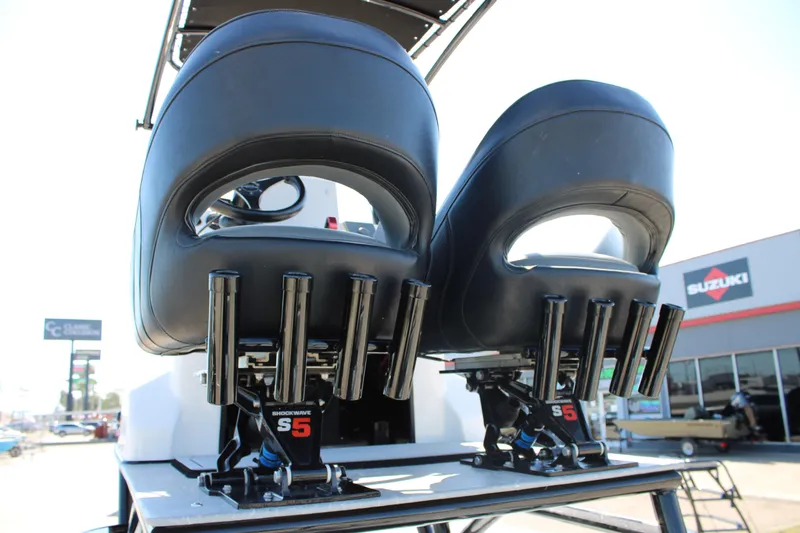 Slide: The Image of 2024 Shoalwater 23 Catamaran boat with outboard motor, viewed from above. - 24