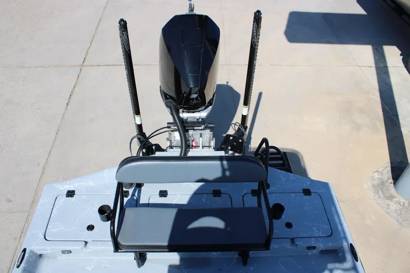 Slide: The Image of 2024 Shoalwater 23 Catamaran dashboard with steering wheel and navigation system. - 25