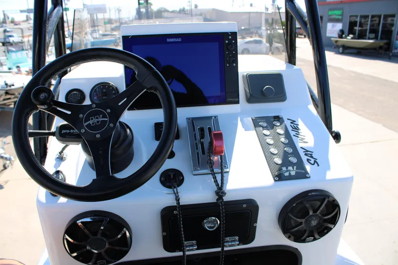 Slide: The Image of Dashboard of 2024 Shoalwater 23 Catamaran featuring RPM gauge and lift plate control. - 26