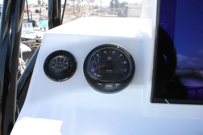 Slide: The Image of Simrad display on 2024 Shoalwater 23 Catamaran dashboard with gauge. - 27