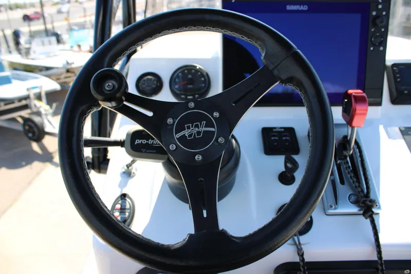 Slide: The Image of 2024 Shoalwater 23 Catamaran interior with speaker and cup holders. - 30