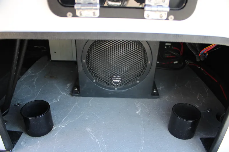 Slide: The Image of 2024 Shoalwater 23 Catamaran with SeaDek flooring, steering wheel, and seating detail. - 31