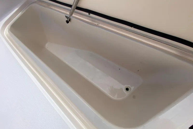 Slide: The Image of 2005 Grady-White Advance 257 boat storage compartment, open and empty. - 103