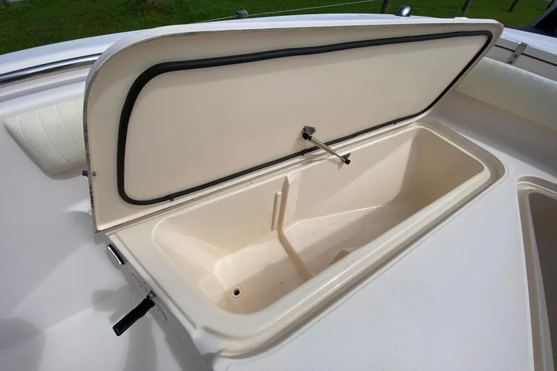 Slide: The Image of Open storage compartment on 2005 Grady-White Advance 257 boat, showcasing interior space. - 105