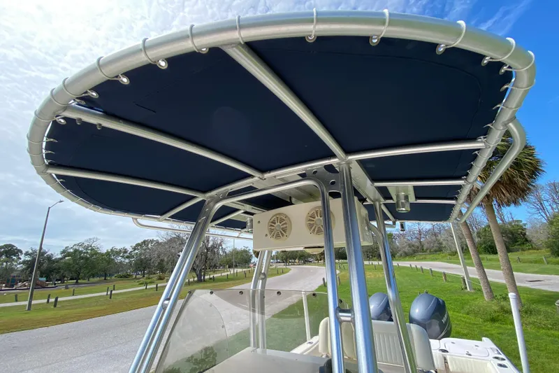 Slide: The Image of 2005 Grady-White Advance 257 boat with T-top canopy and dual engines. - 109