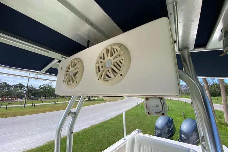 Slide: The Image of 2005 Grady-White Advance 257 boat speakers and canopy, with Yamaha engines in background. - 111