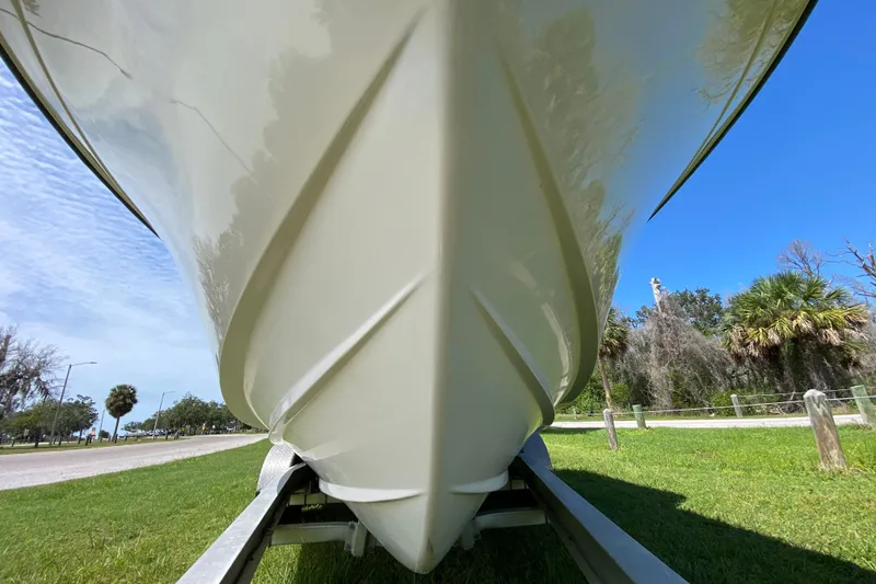 Slide: The Image of 2005 Grady-White Advance 257 boat on trailer, viewed from below, against blue sky. - 14