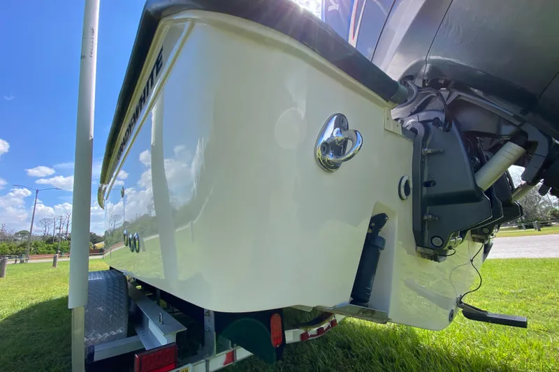 Slide: The Image of 2005 Grady-White Advance 257 boat on trailer, sunny day, grassy area. - 21