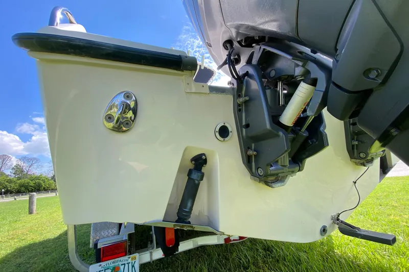 Slide: The Image of 2005 Grady-White Advance 257 boat engine and stern detail on grass. - 22