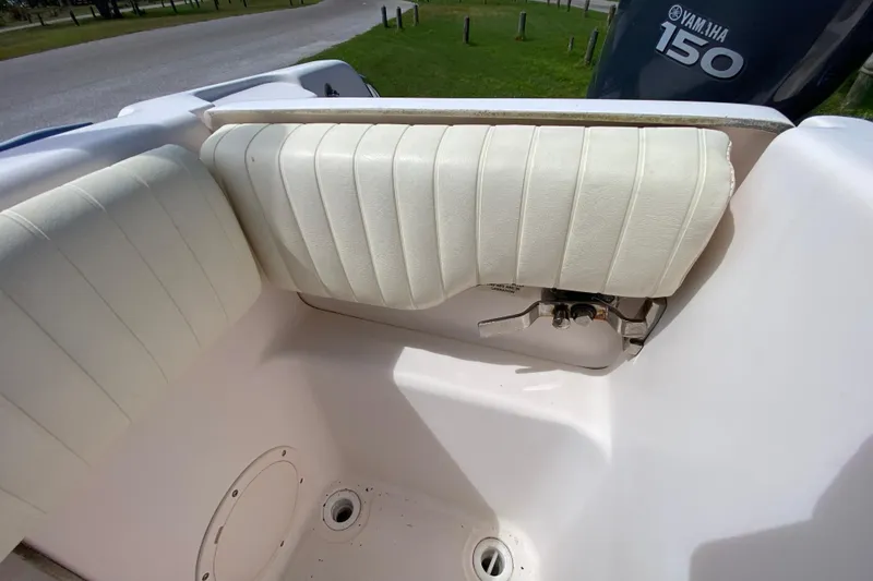 Slide: The Image of 2005 Grady-White Advance 257 boat interior with Yamaha 150 engine detail. - 34