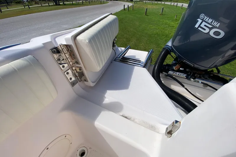 Slide: The Image of 2005 Grady-White Advance 257 boat interior with Yamaha 150 engine. - 35