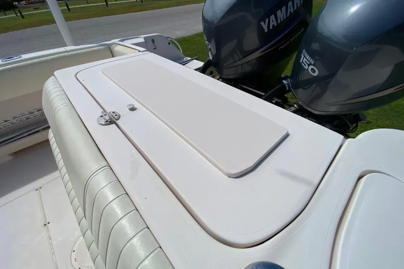 Slide: The Image of 2005 Grady-White Advance 257 boat with Yamaha 150 engines, featuring a cushioned seating area. - 36