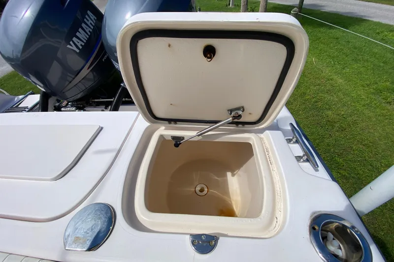 Slide: The Image of Open storage compartment on a 2005 Grady-White Advance 257 boat with Yamaha engines. - 38