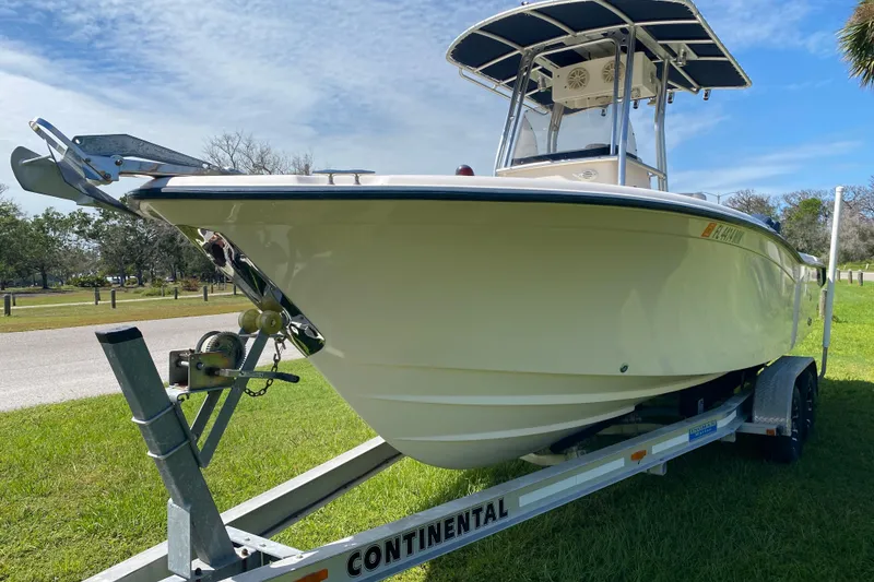 Slide: The Image of 2005 Grady-White Advance 257 boat on trailer, parked on grass under blue sky. - 4