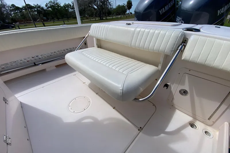 Slide: The Image of 2005 Grady-White Advance 257 boat interior with cushioned seating and Yamaha engines. - 41