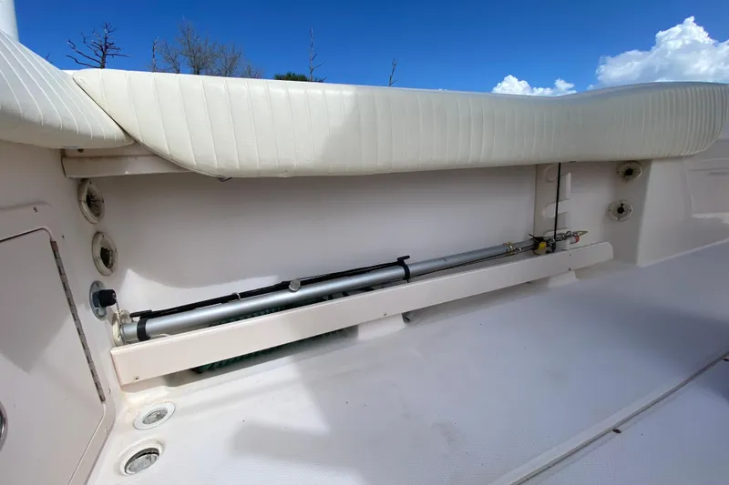 Slide: The Image of 2005 Grady-White Advance 257 boat interior with seating and storage compartment. - 48