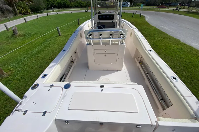 Slide: The Image of 2005 Grady-White Advance 257 boat interior, featuring spacious deck and seating. - 49