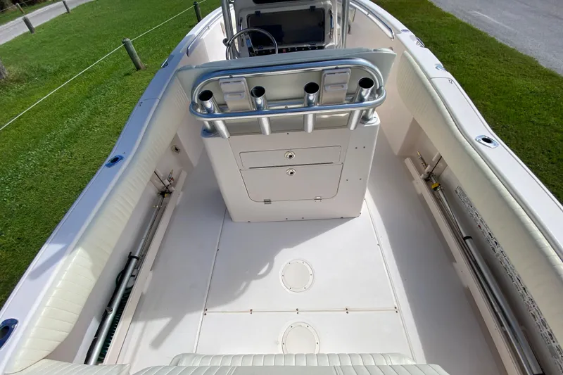 Slide: The Image of 2005 Grady-White Advance 257 boat interior with rod holders and storage compartments. - 50