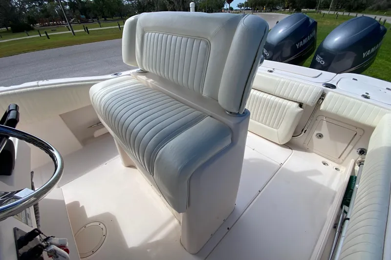 Slide: The Image of 2005 Grady-White Advance 257 boat interior with seating and dual Yamaha engines. - 58