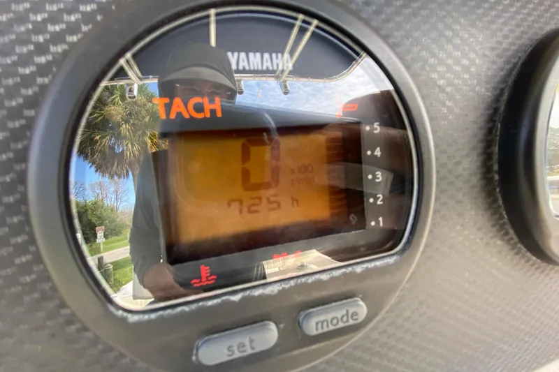 Slide: The Image of Tachometer display on 2005 Grady-White Advance 257 boat showing 725 hours. - 65