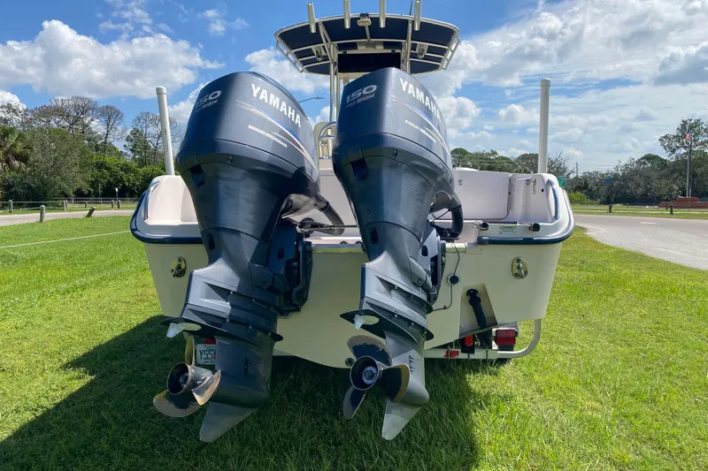 Slide: The Image of 2005 Grady-White Advance 257 boat with twin Yamaha outboard motors on grass. - 7