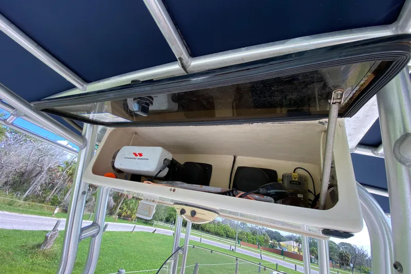 Slide: The Image of 2005 Grady-White Advance 257 boat electronics compartment with Standard Horizon equipment. - 74