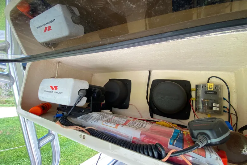 Slide: The Image of 2005 Grady-White Advance 257 boat electronics compartment with Standard Horizon equipment. - 75