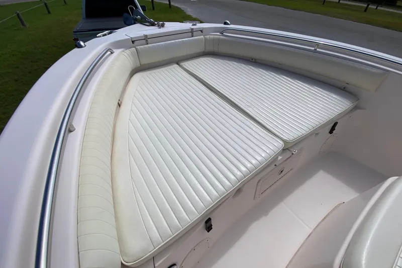 Slide: The Image of 2005 Grady-White Advance 257 boat with white cushioned seating and stainless steel railings. - 88