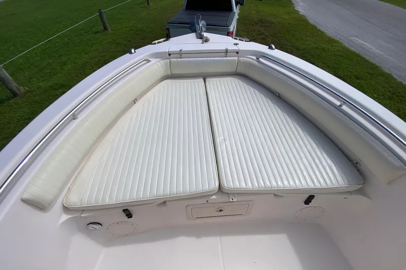 Slide: The Image of 2005 Grady-White Advance 257 boat with cushioned bow seating and stainless steel railings. - 89