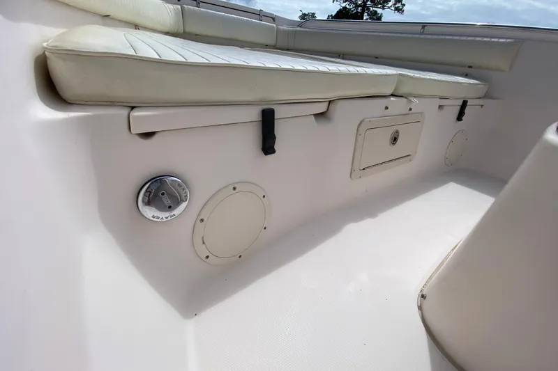 Slide: The Image of 2005 Grady-White Advance 257 boat interior with seating and storage compartments. - 91